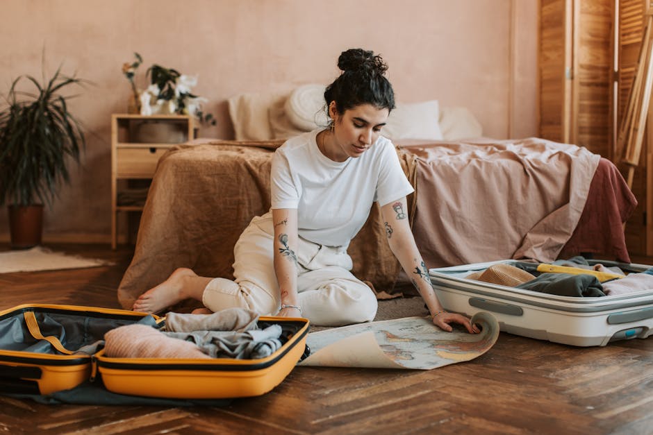 woman planning outfits on bed