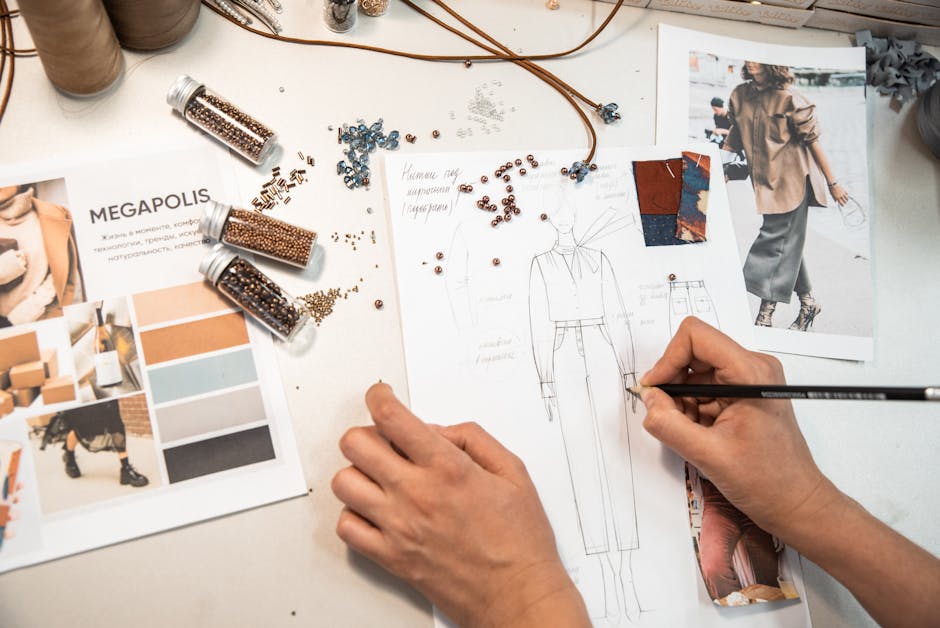 woman sketching fashion designs with mood board