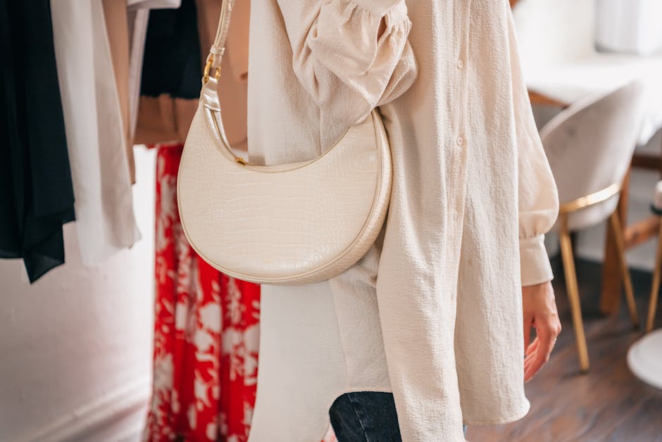 woman styling outfit with accessories