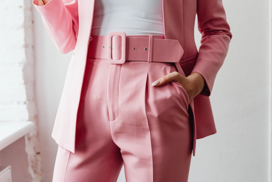 woman tying belt sophisticated look