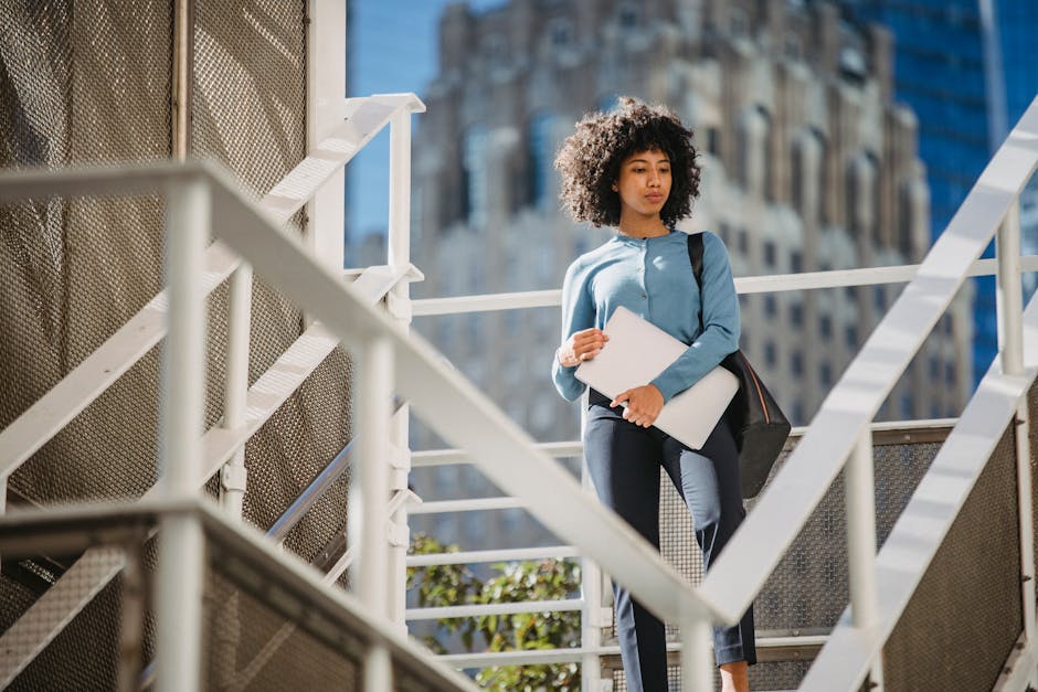 woman walking stairs office