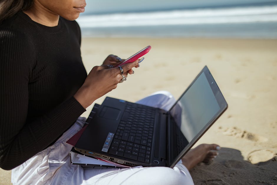 Woman working remotely Brazil beach laptop